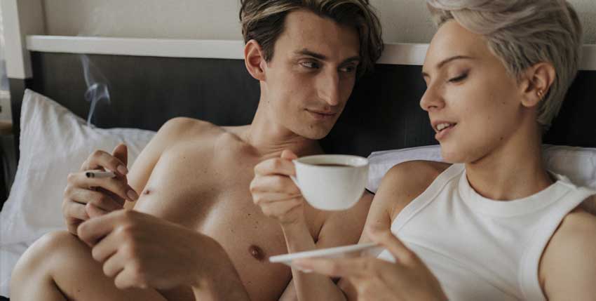couple smoking cbd in bed